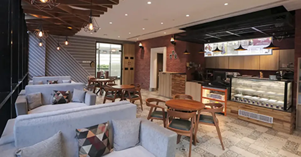 Elegant living room with blue ottoman